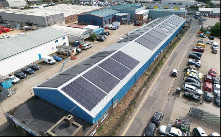 Drone photograph of solar panels on an industrial unit roof